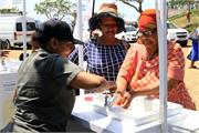 Celiwe Mswane demonstrating to the members of the public on how to wash hands hygienically at Presidential District Model launch in Kwa-Mashu stadium